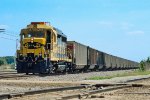 BNSF 2467, ex ATSF EMD GP30, leads a westbound empty hopper train at Eola Yard 